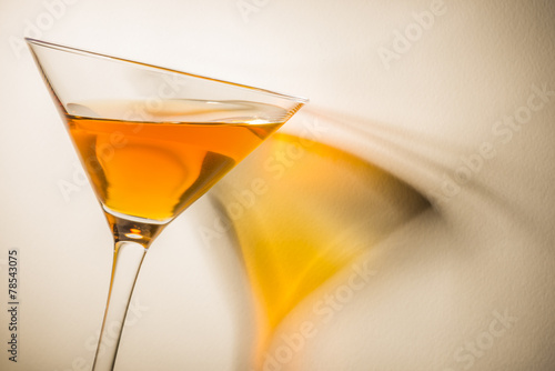 Fotografie Orange liqueur into a martini glass.
