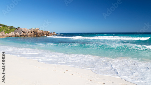 human footprints on the white sand