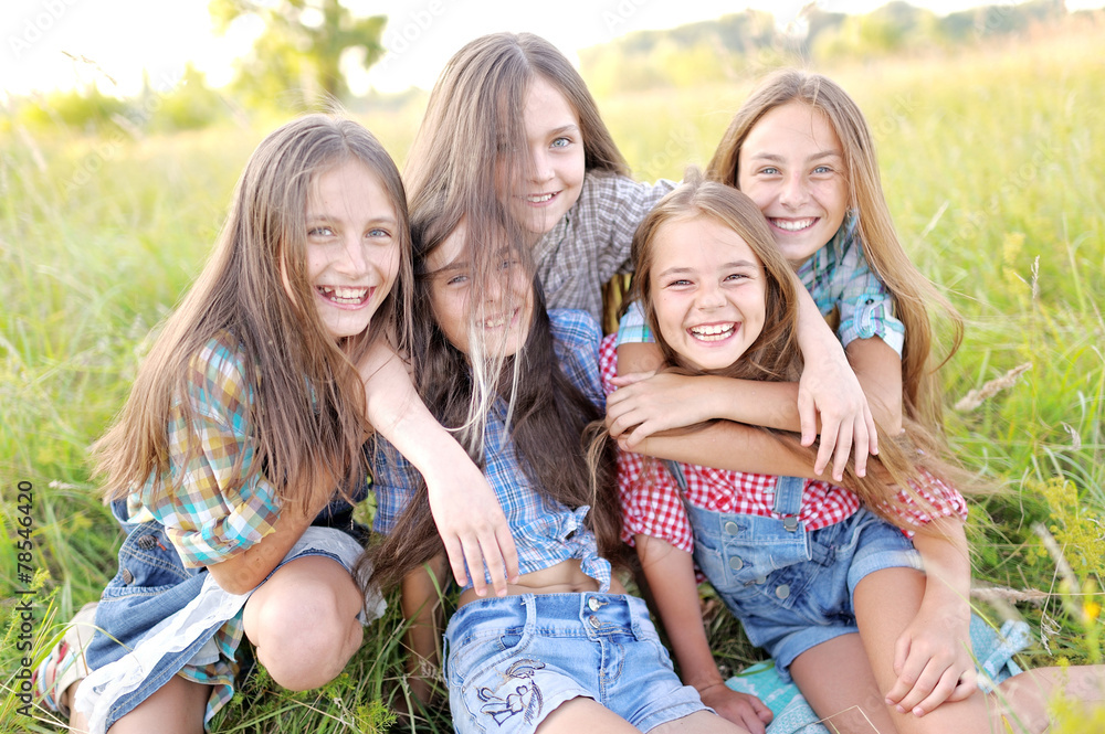 Portrait of joyful beautiful girlfriends on the nature Portrait of joyful beautiful girlfriends on the nature