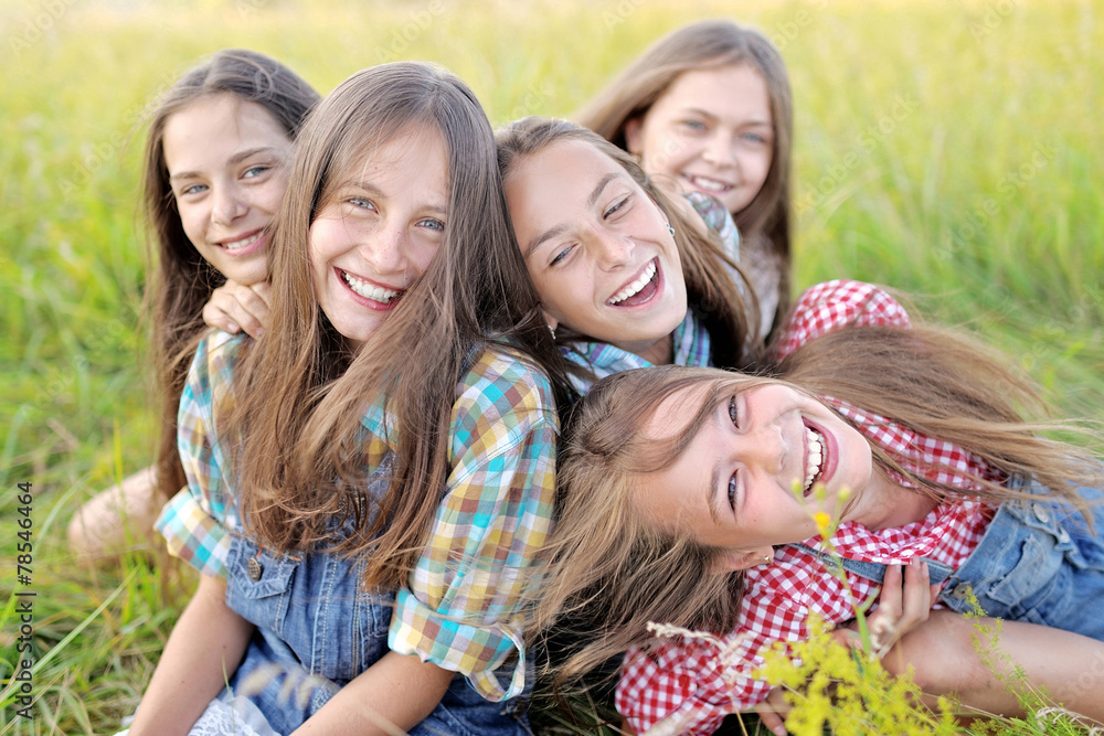 Portrait of joyful beautiful girlfriends on the nature Portrait of joyful beautiful girlfriends on the nature