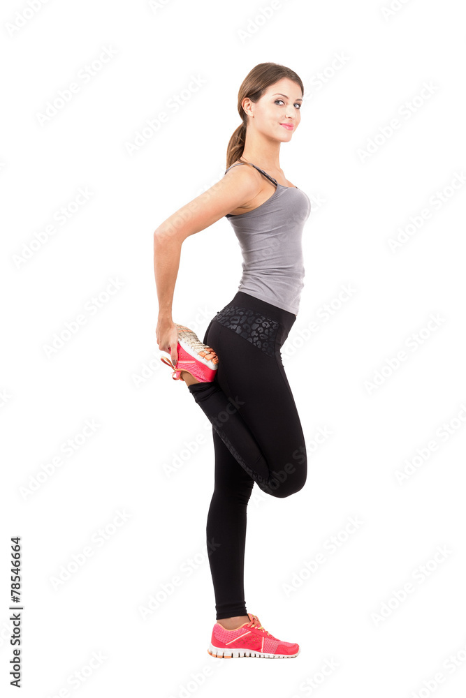 Sport woman stretching leg side view Sport woman stretching leg side view