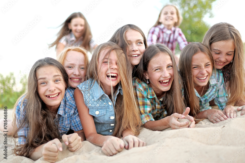 Fototapeta premium Portrait of joyful beautiful girlfriends on the nature