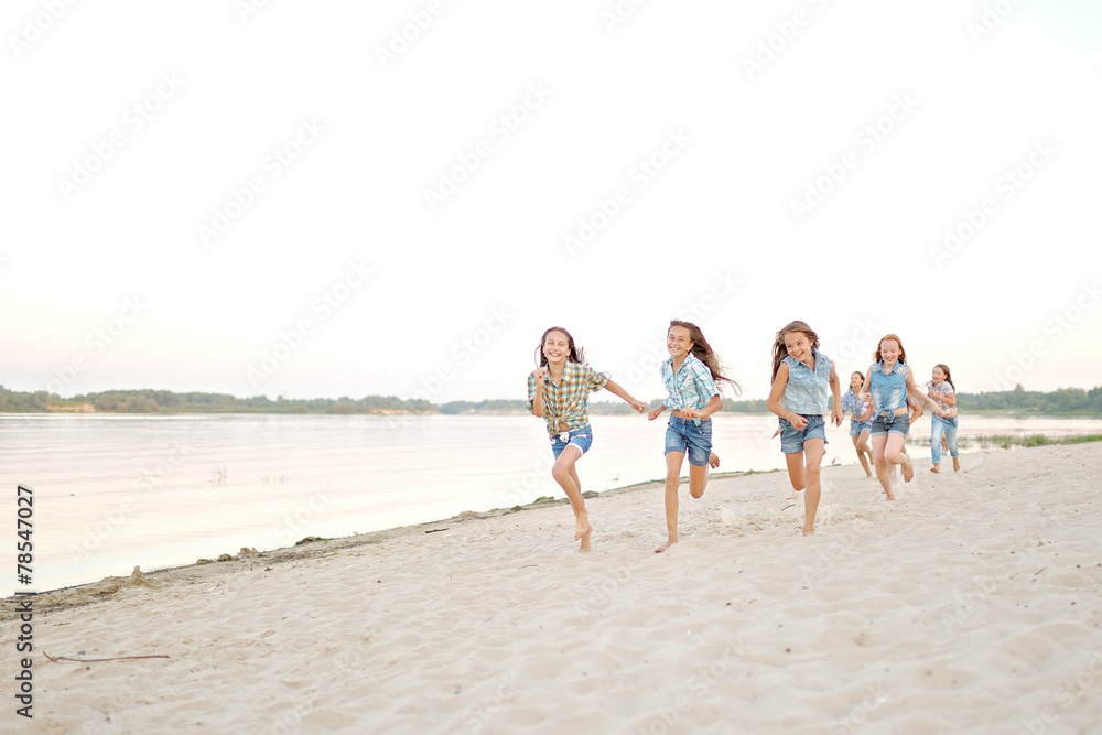 Portrait of joyful beautiful girlfriends on the nature