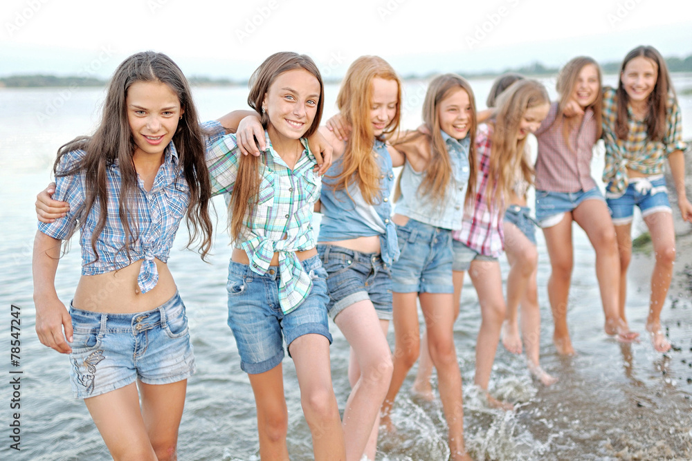 Portrait of joyful beautiful girlfriends on the nature Portrait of joyful beautiful girlfriends on the nature