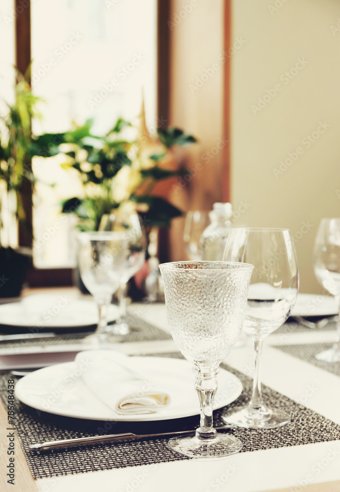 Place setting in a restaurant, toned image Place setting in a restaurant, toned image