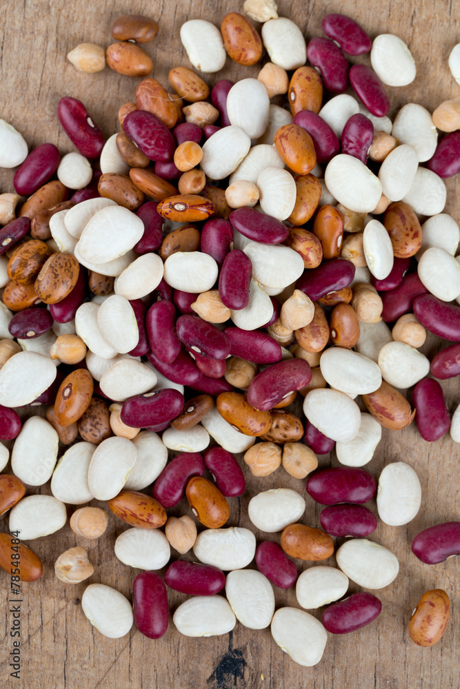 various beans on wooden surface various beans on wooden surface