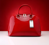 Red handbag on a red background