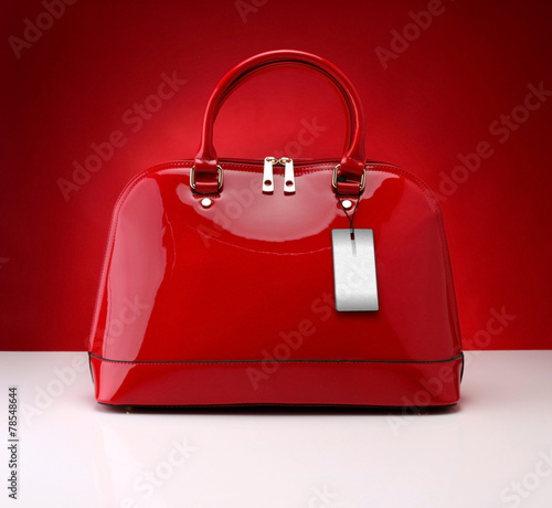 Red handbag on a red background