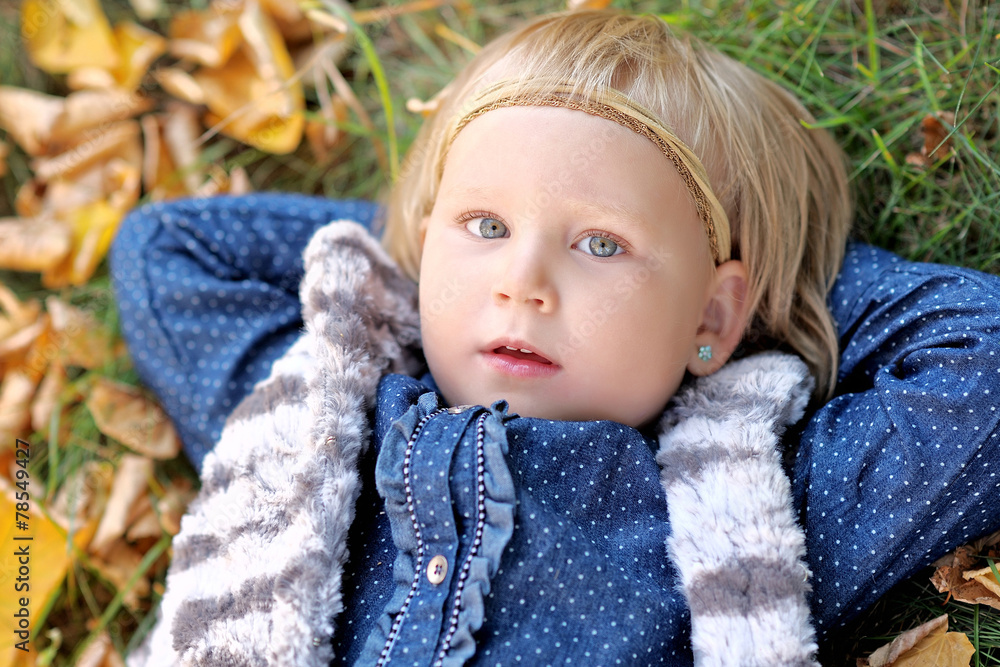 portrait of little girl outdoors in autumn
