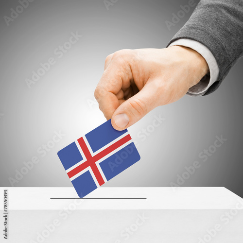 Voting concept - Male inserting flag into ballot box - Iceland