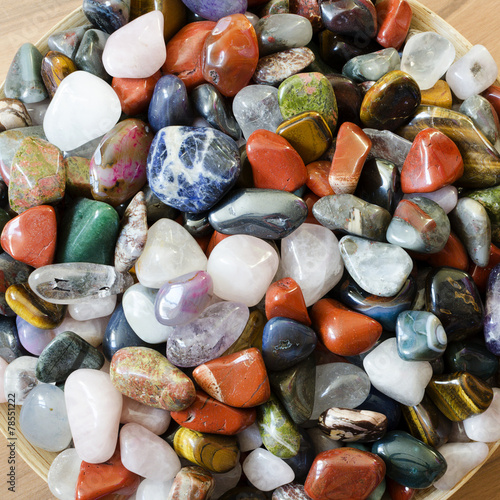 Colorful semi precious stones background © Pavla Zakova