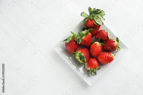 Beautiful strawberries on the wooden table