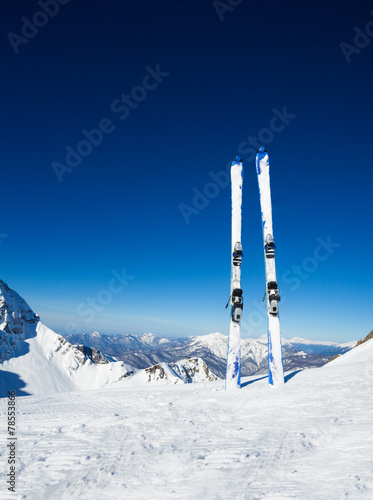 Two skies in snow on mountain ski resort