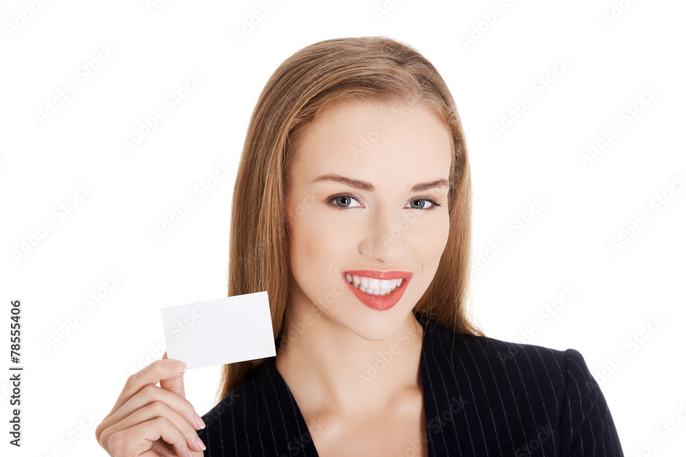 Young business woman holding small personal card. Young business woman holding small personal card.