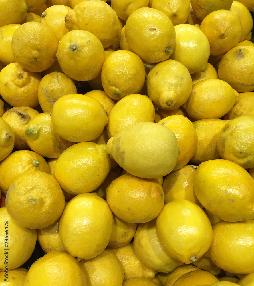 Pile of fresh lemons at market