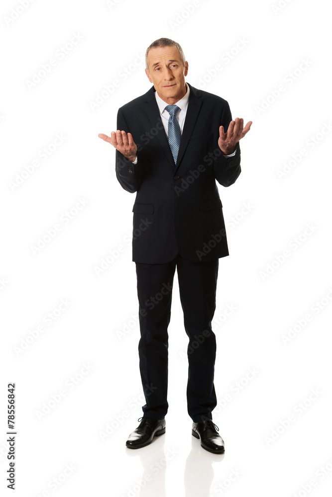 Full length businessman making undecided gesture Full length businessman making undecided gesture