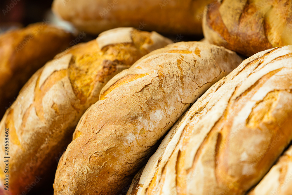 many brown rustic fresh rye bread loaves