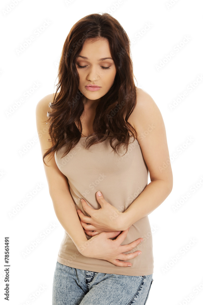 Woman suffering from severe pain in her tummy. Woman suffering from severe pain in her tummy.