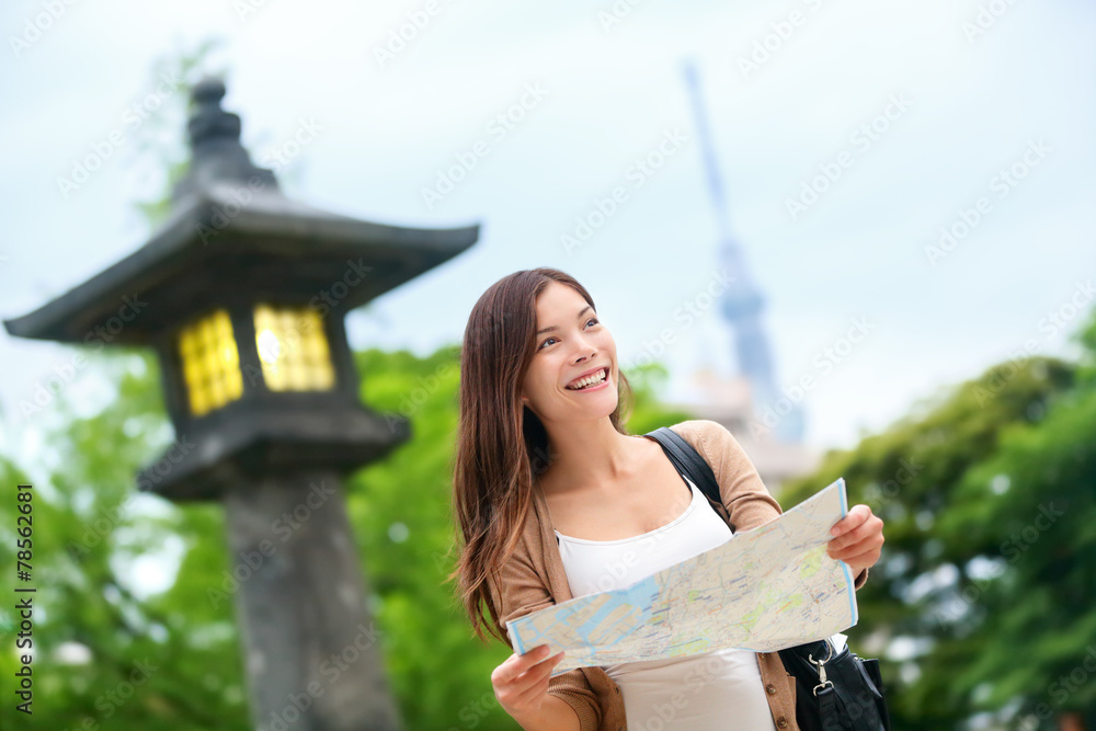 Naklejka premium Travel in Tokyo - Asian tourist woman with map