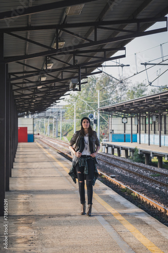 Pretty girl posing in a metro station