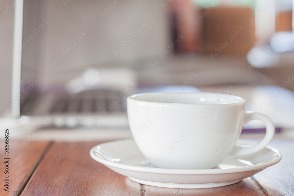 White coffee cup on work station White coffee cup on work station