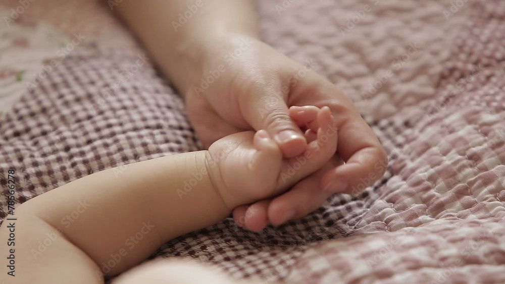 the child's mother a hand to hold when baby is sleeping the child's mother a hand to hold when baby is sleeping