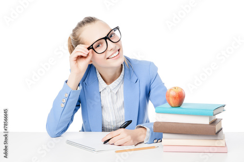 Smiling student with stack of books