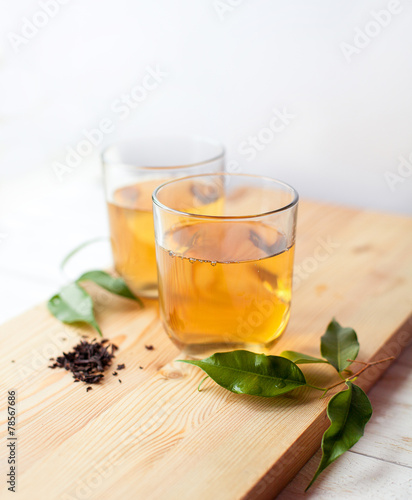 cup of green tea on wooden table