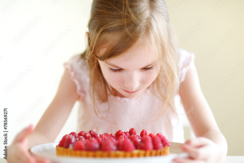 Adorable little girl and a raspberry cake Adorable little girl and a raspberry cake