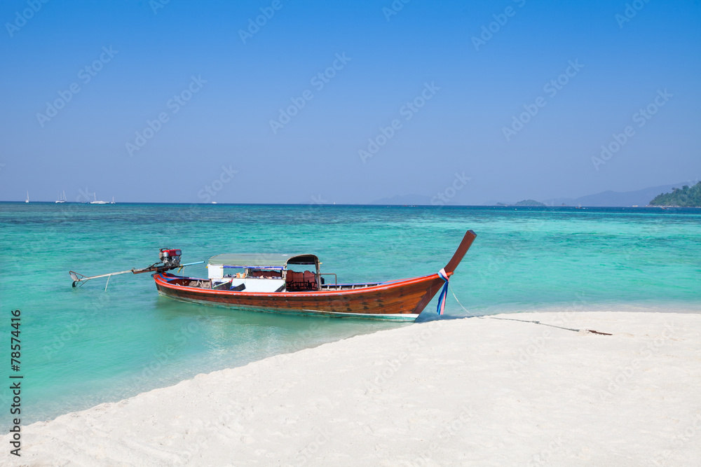 Long-tailed boat and beach