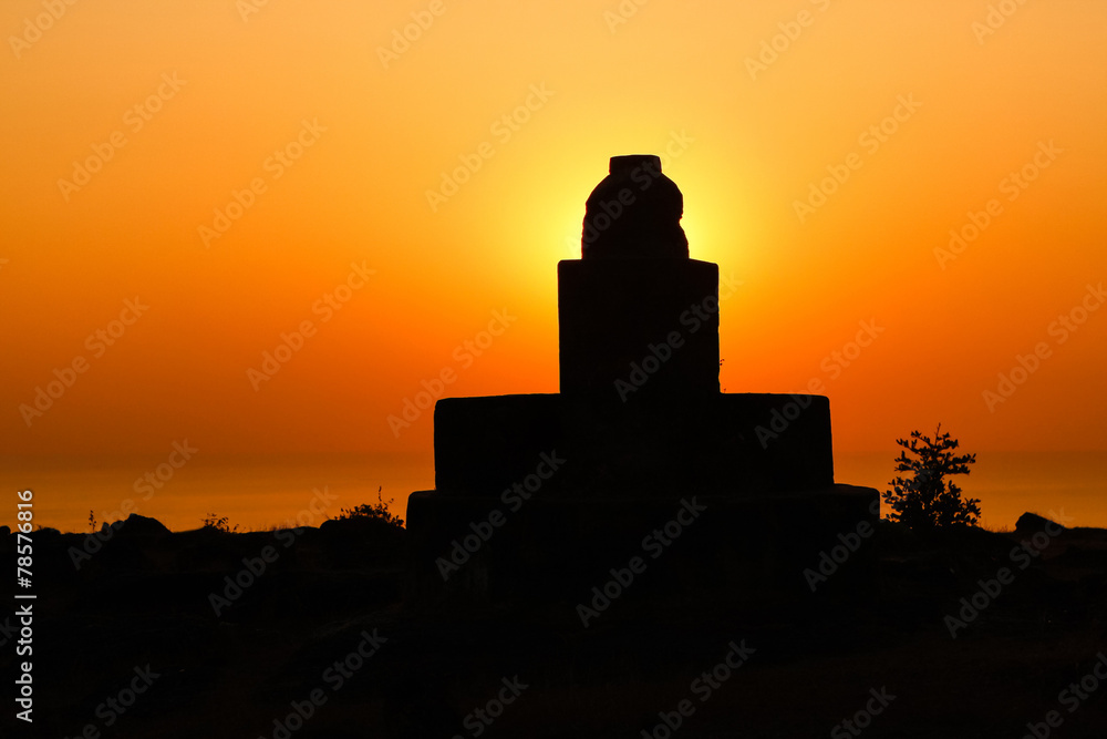 sunset on the sea with silhouette of the building sunset on the sea with silhouette of the building