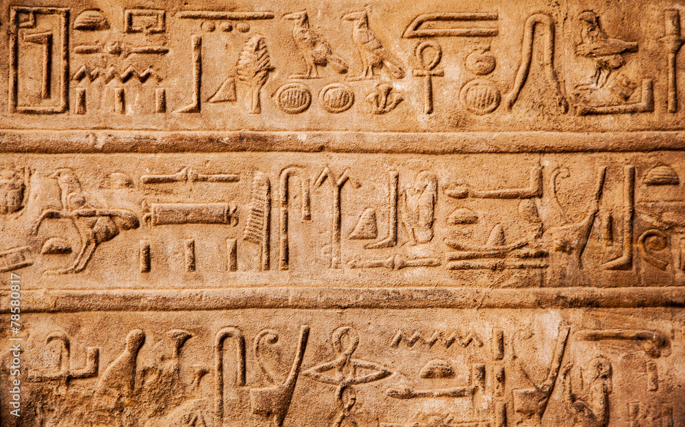 old egypt hieroglyphs carved on the stone