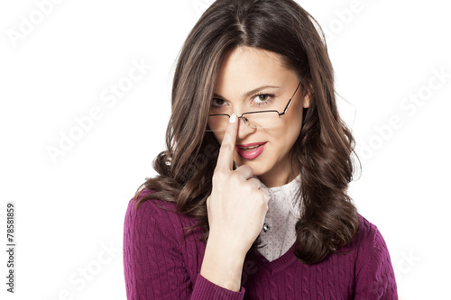 seductive young woman with the glasses on a white background