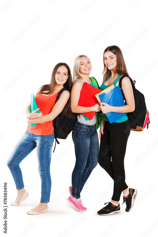 Three smiling college students on a white background Three smiling college students on a white background