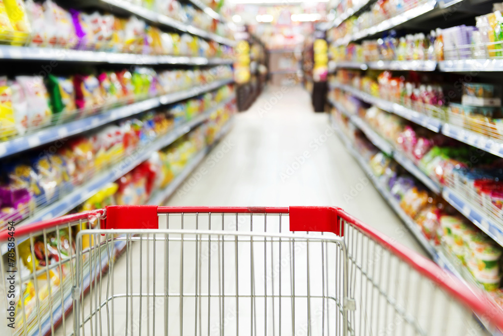 Supermarket interior, empty red shopping cart. Supermarket interior, empty red shopping cart.