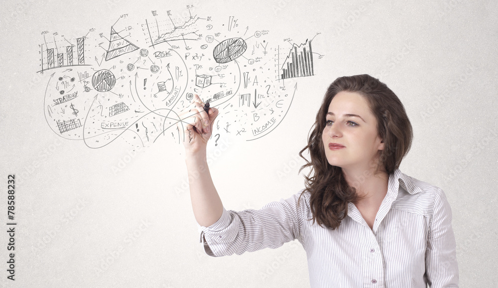 Pretty girl sketching graphs and diagrams on wall Pretty girl sketching graphs and diagrams on wall