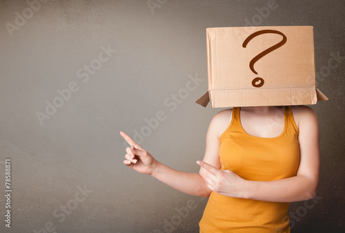 Young lady gesturing with a cardboard box on her head with quest photo