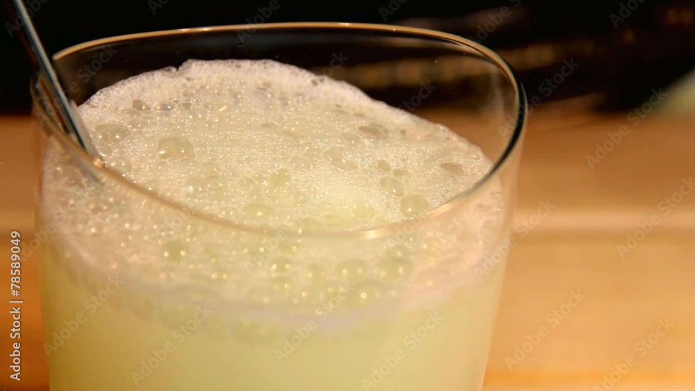 Large white tablet dissolved in a glass of water with a spoon Large white tablet dissolved in a glass of water with a spoon