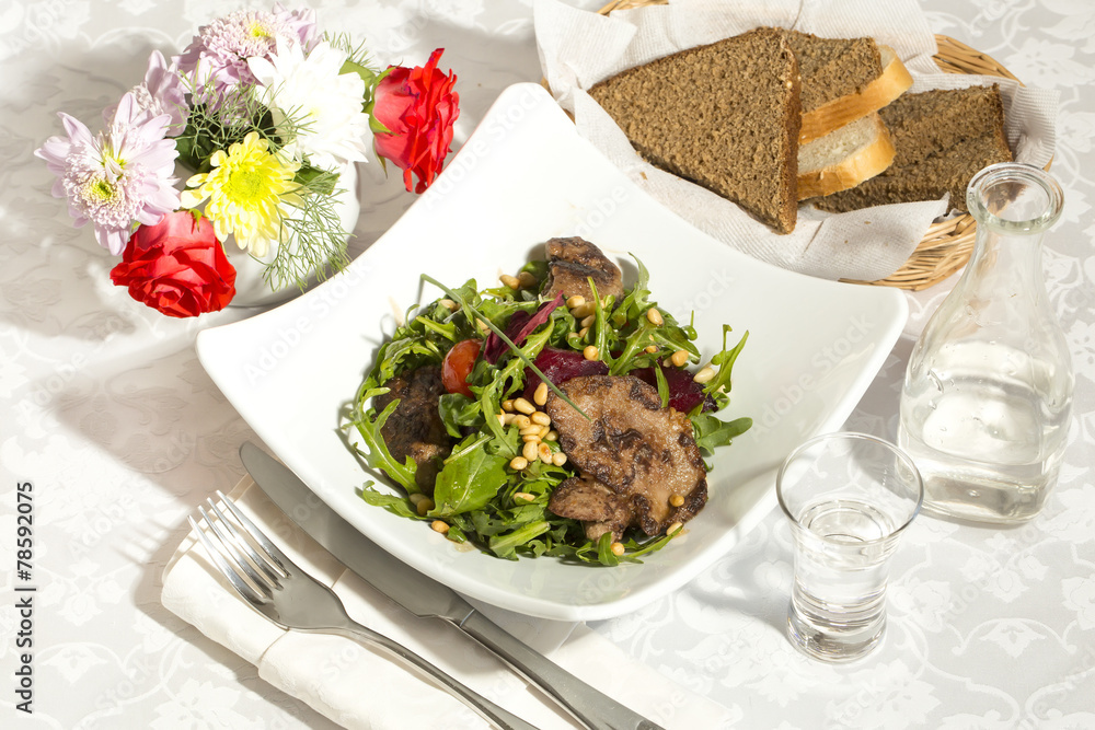 rabbit liver salad with arugula in a restaurant rabbit liver salad with arugula in a restaurant