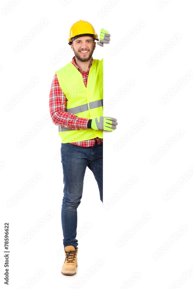 Manual worker behind big white placard Manual worker behind big white placard