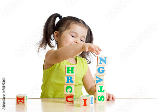 Little girl playing with wo...