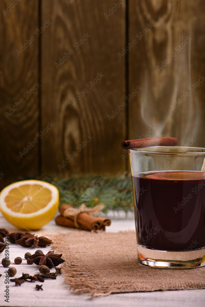 Mulled wine, punch and spices for glintwine on wooden background Mulled wine, punch and spices for glintwine on wooden background