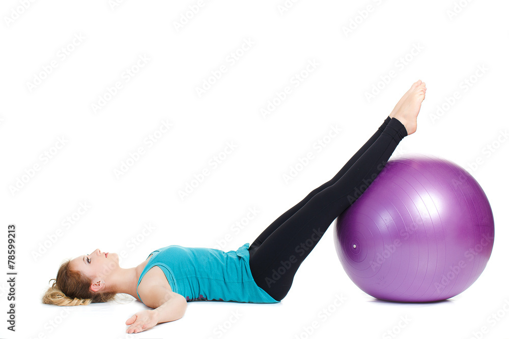 Girl-fitness instructor,shows exercises with a large ball. Girl-fitness instructor,shows exercises with a large ball.