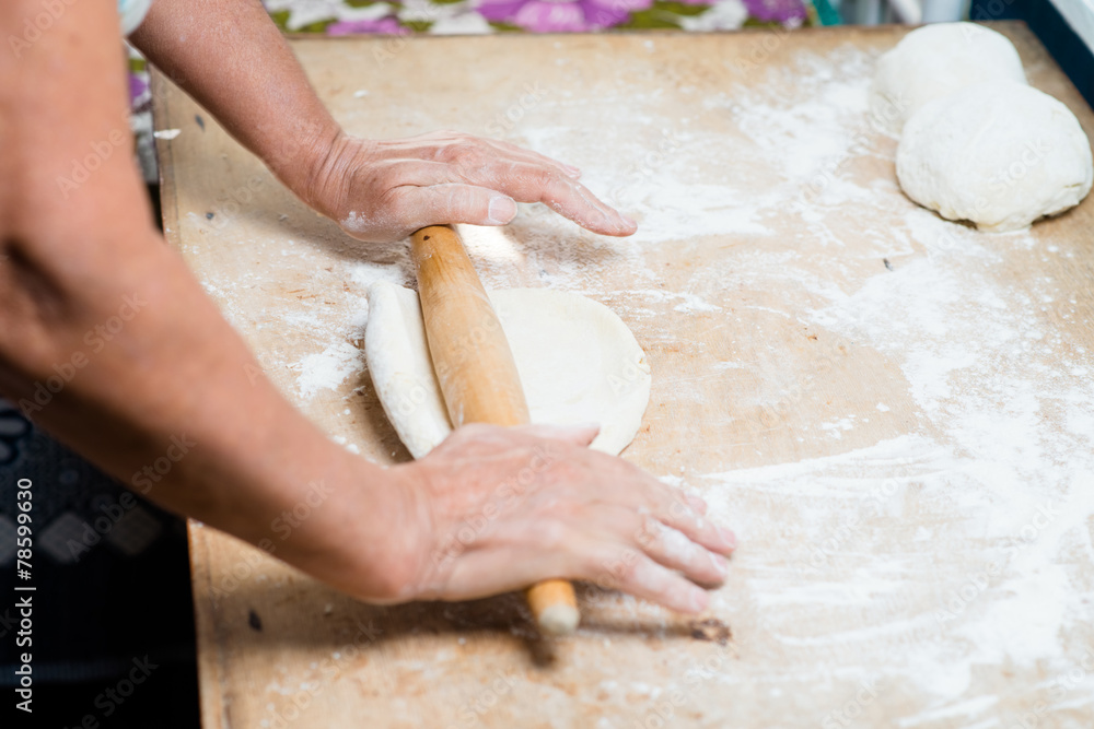 hand with rolling pin and flour hand with rolling pin and flour
