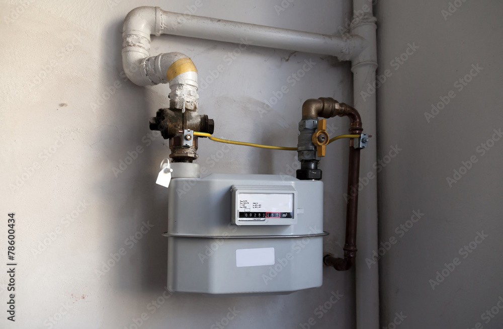 Gas meter on the white wall Gas meter on the white wall