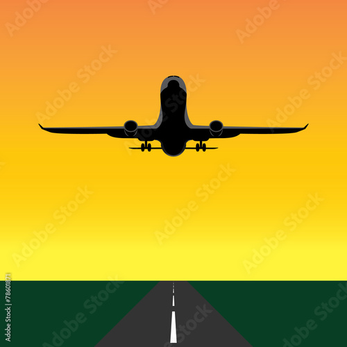 Front of a plane ,taking off during sunset