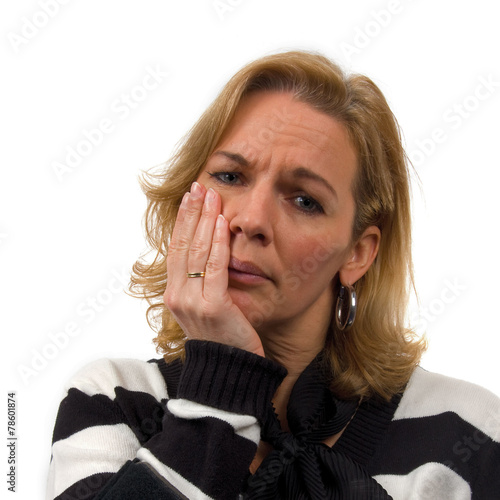 Woman is heaving toothache over white background photo