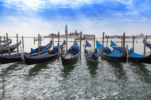 Fototapeta Naklejka Na Ścianę i Meble -  Moored gondolas in Venice, Italy.
