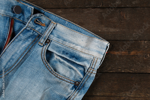 Jeans on wooden surface