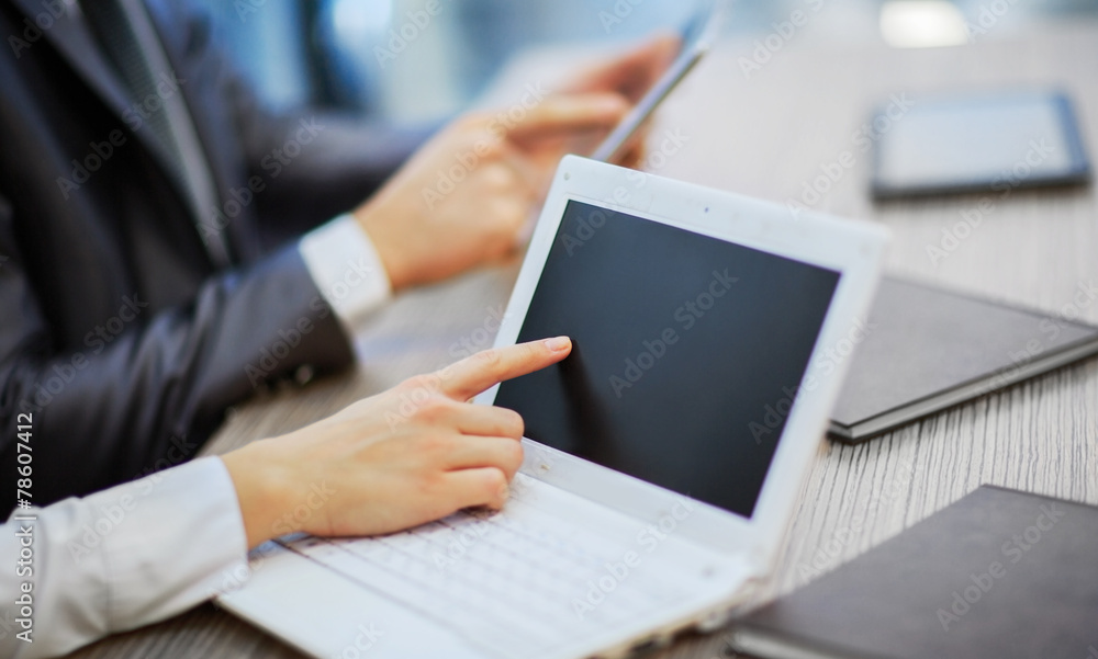 Hands of people working with tablet computer.
